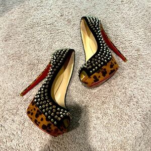 Red bottom. Platform heels. Size 6. Metallic spikes, red bottom